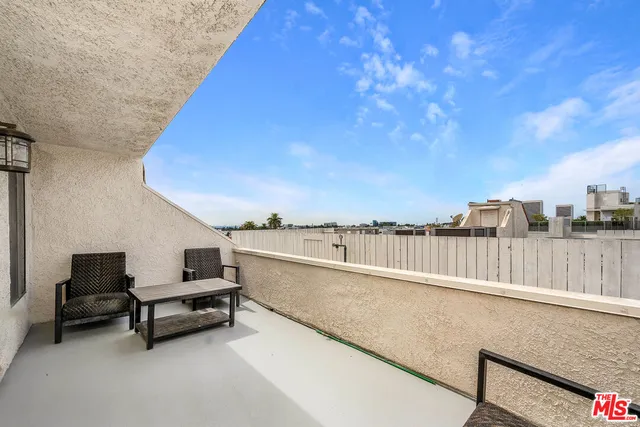 a balcony with outdoor seating