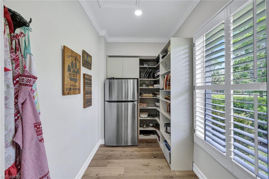 4624 Pond Apple Drive North Naples, FL 34119 - Photo 17 of 46 a view of walk in closet with clothes and shoes