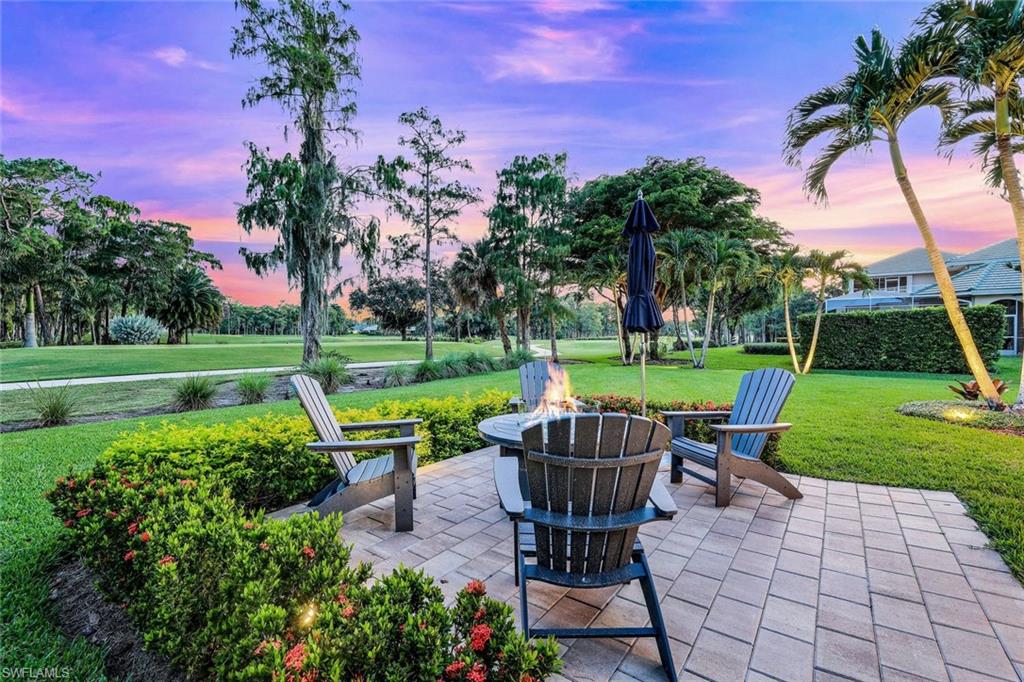 4624 Pond Apple Drive North Naples, FL 34119 - Photo 2 of 46 a view of a chair and table in the garden