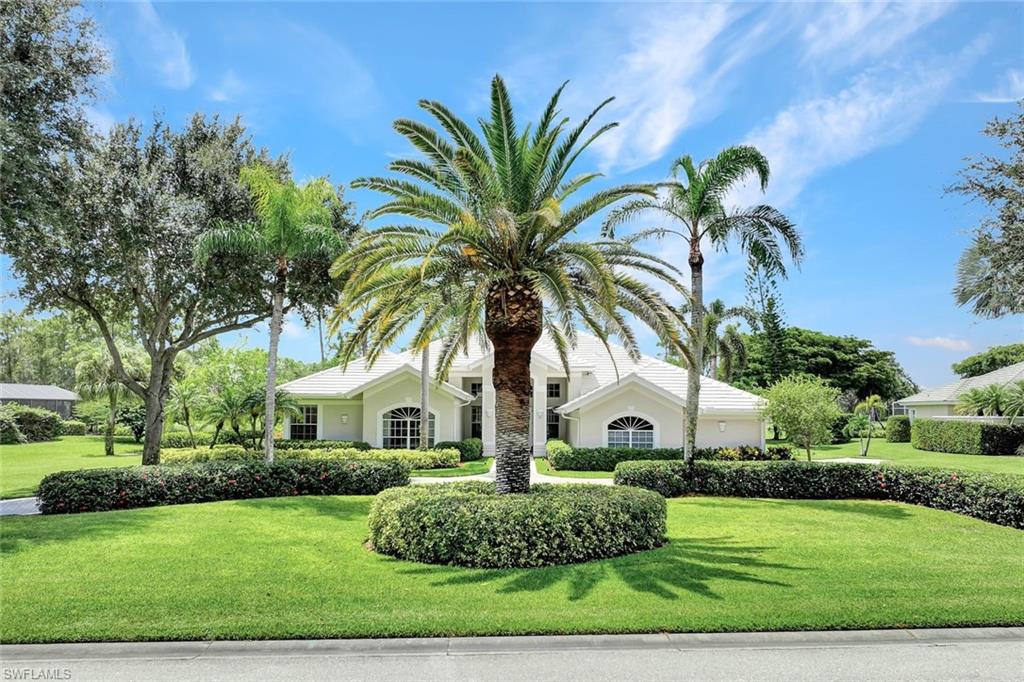 4624 Pond Apple Drive North Naples, FL 34119 - Photo 3 of 46 a front view of a house with porch and furniture