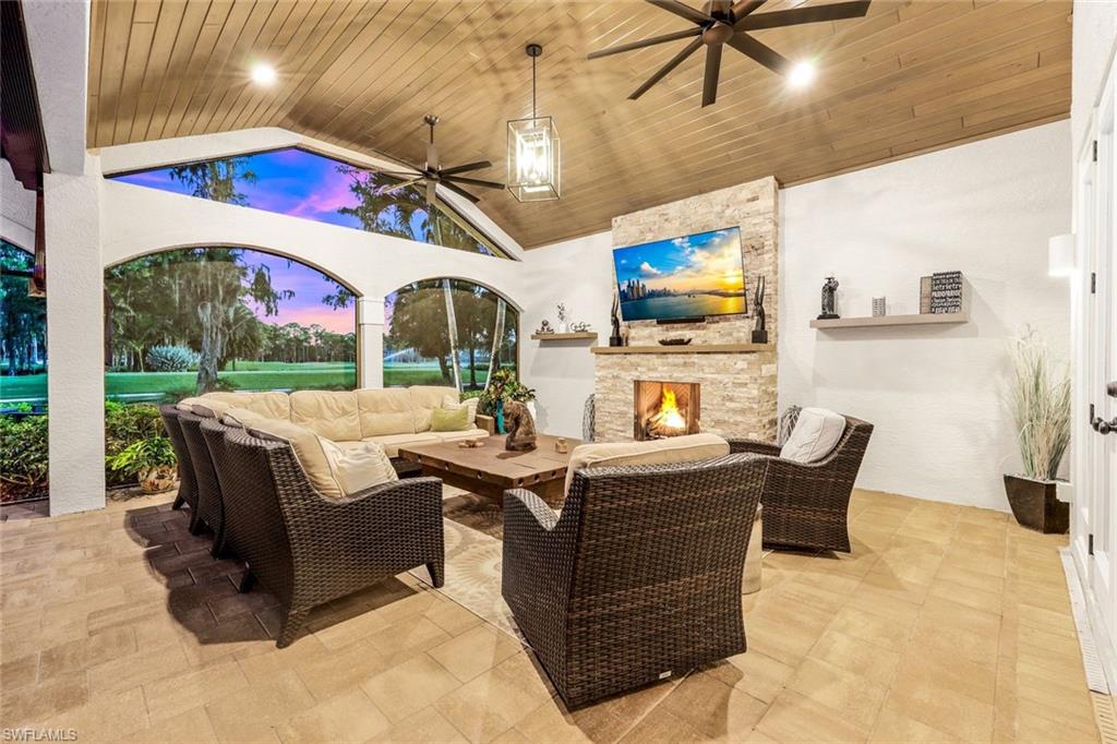 4624 Pond Apple Drive North Naples, FL 34119 - Photo 33 of 46 a view of a patio with couches table and chairs