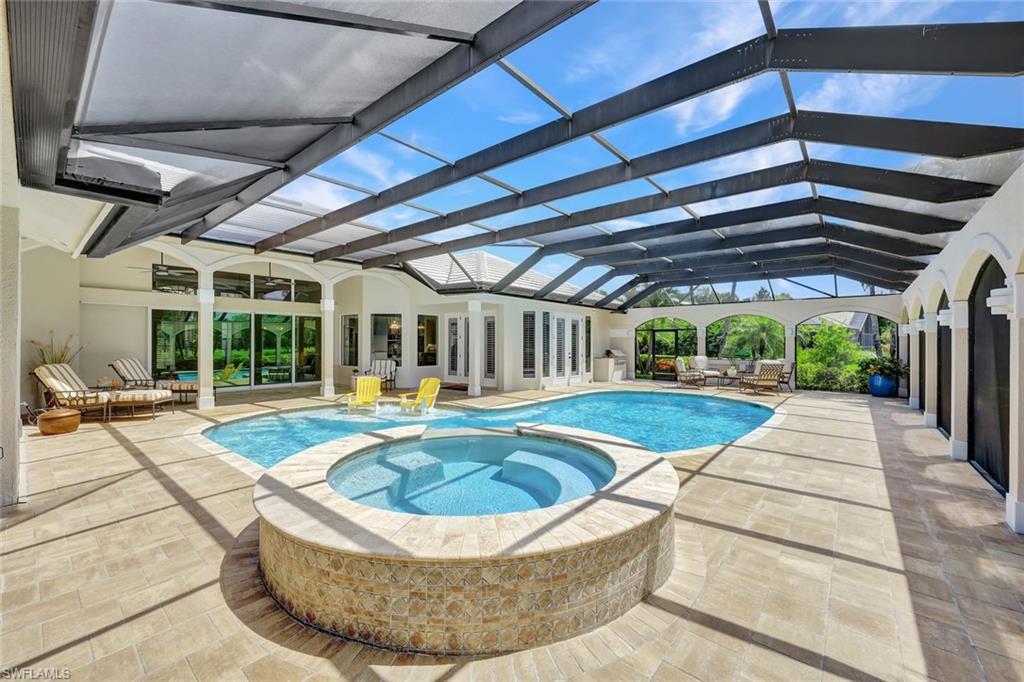 4624 Pond Apple Drive North Naples, FL 34119 - Photo 39 of 46 a view of swimming pool with seating space