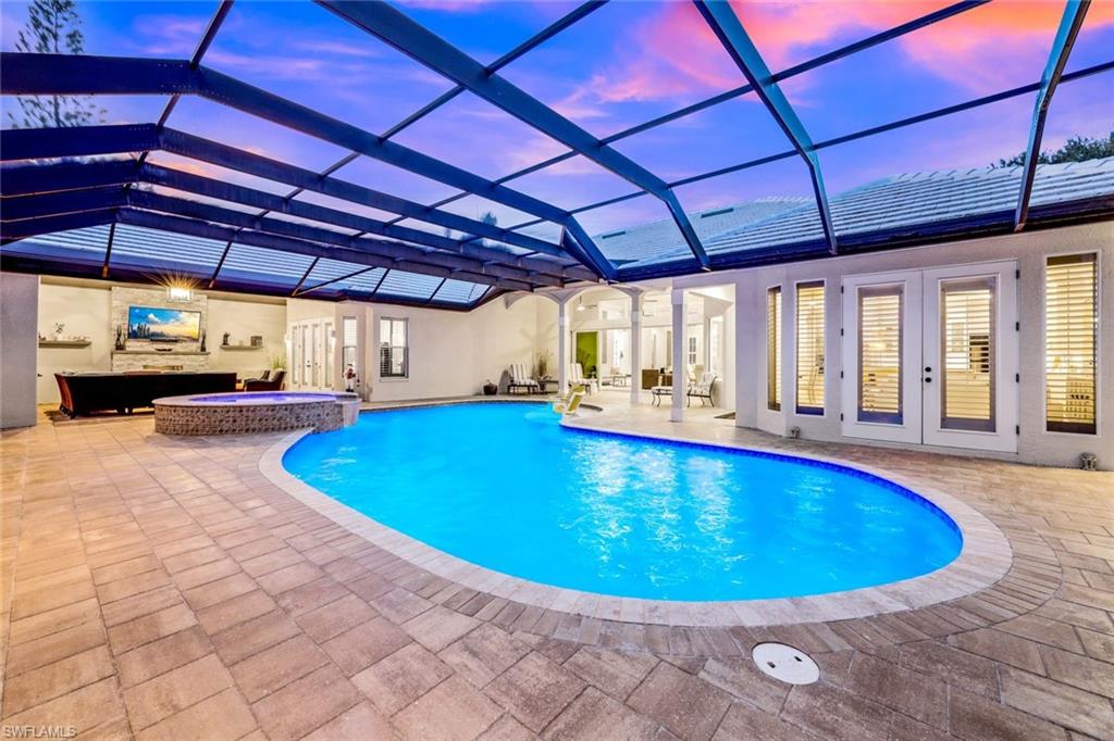 4624 Pond Apple Drive North Naples, FL 34119 - Photo 40 of 46 a view of indoor pool and sitting area