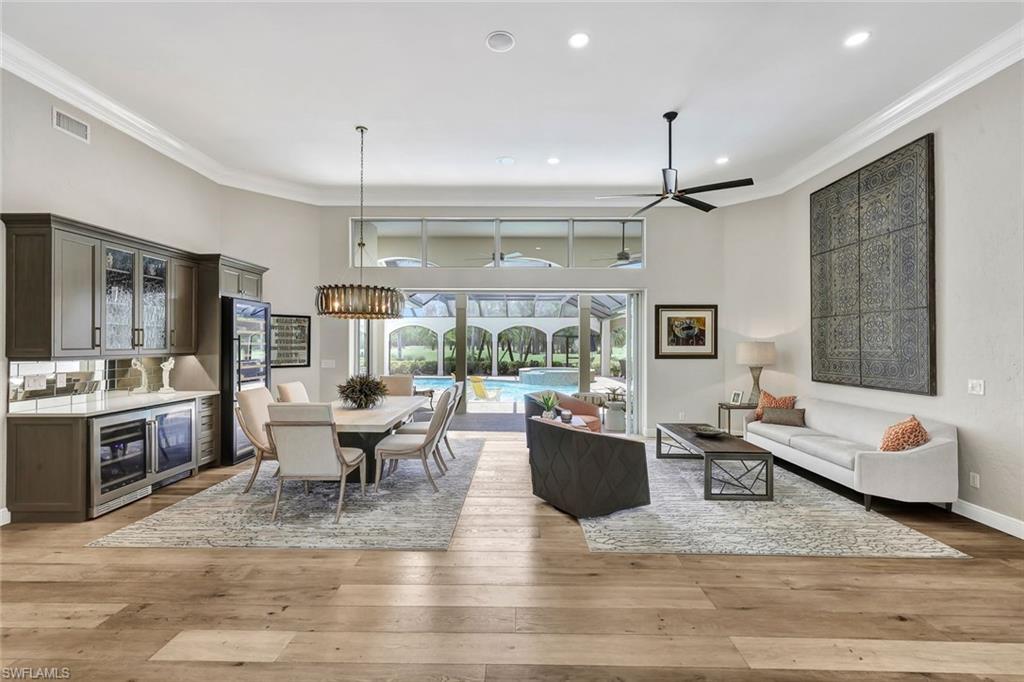 4624 Pond Apple Drive North Naples, FL 34119 - Photo 4 of 46 a living room with furniture and a large window