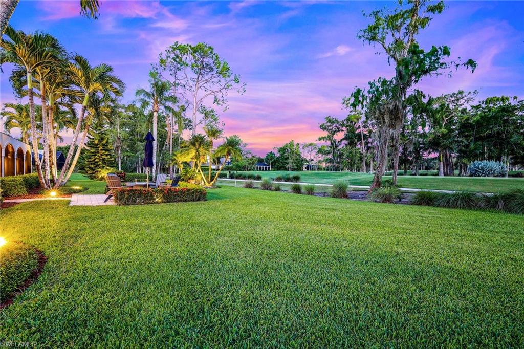 4624 Pond Apple Drive North Naples, FL 34119 - Photo 45 of 46 a view of a park with swings and slides