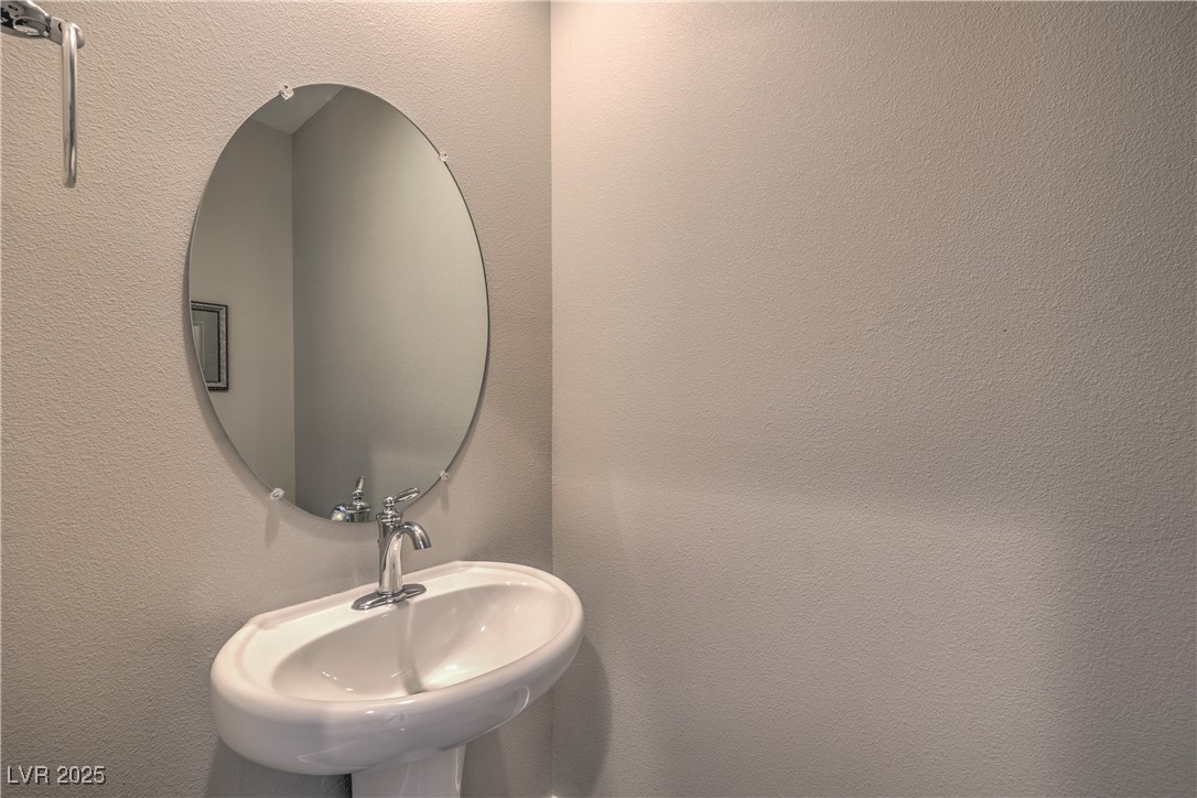2711 Evolutionary Lane Las Vegas, NV 89138 - Photo 18 of 37 Bathroom featuring a sink