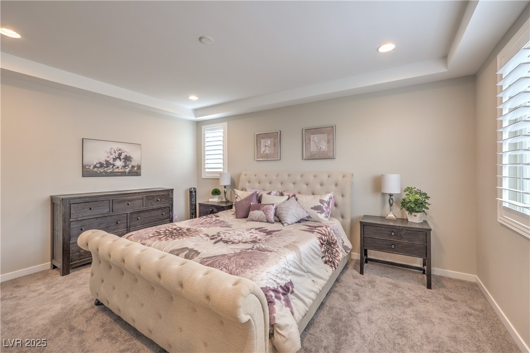 2711 Evolutionary Lane Las Vegas, NV 89138 - Photo 24 of 37 Carpeted bedroom with a raised ceiling, recessed lighting, and baseboards