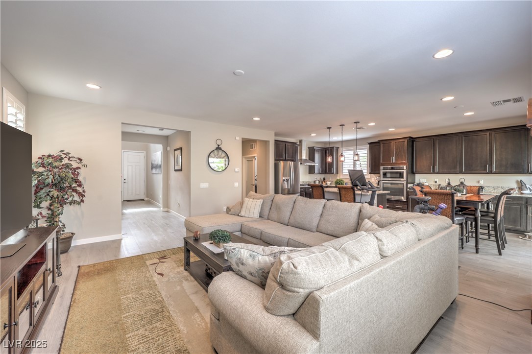 2711 Evolutionary Lane Las Vegas, NV 89138 - Photo 5 of 37 Living room featuring recessed lighting, light wood finished floors, and baseboards
