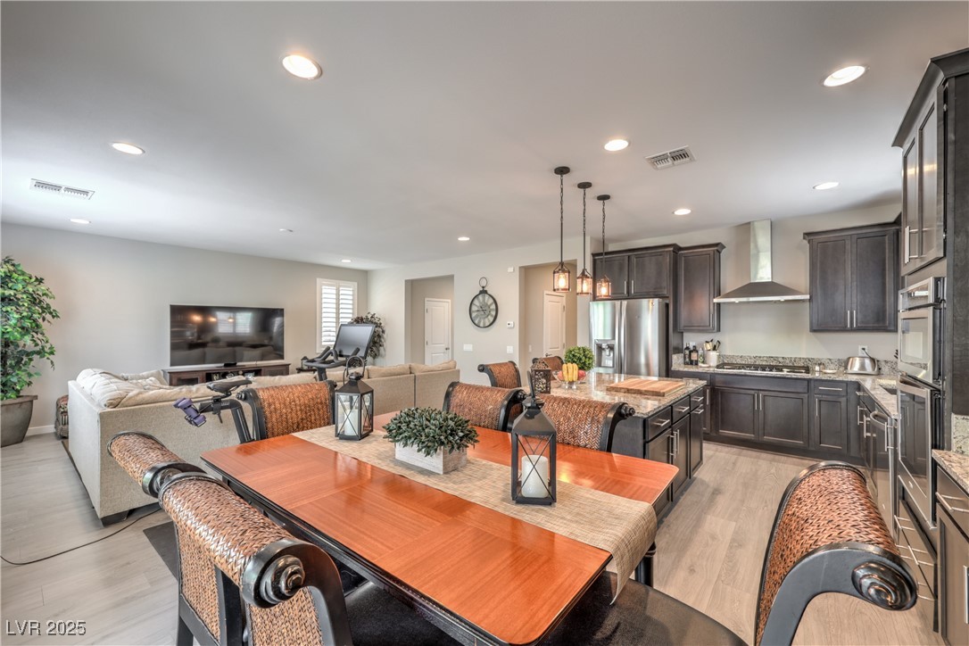 2711 Evolutionary Lane Las Vegas, NV 89138 - Photo 9 of 37 Dining room featuring light wood-style flooring and recessed lighting