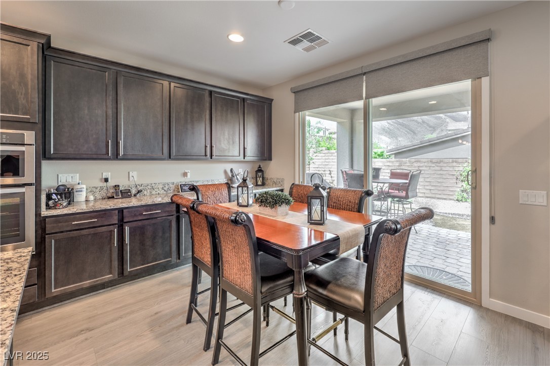 2711 Evolutionary Lane Las Vegas, NV 89138 - Photo 10 of 37 Dining area featuring light wood-type flooring, recessed lighting, and baseboards