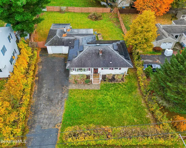 aerial view of a house with a garden
