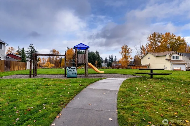 a view of a park with swings