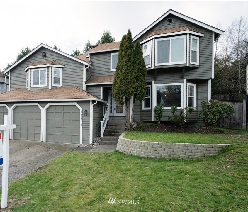 22316 6th Drive Southeast Bothell, WA 98021 - Photo 1 of 35 a front view of a house with a garden