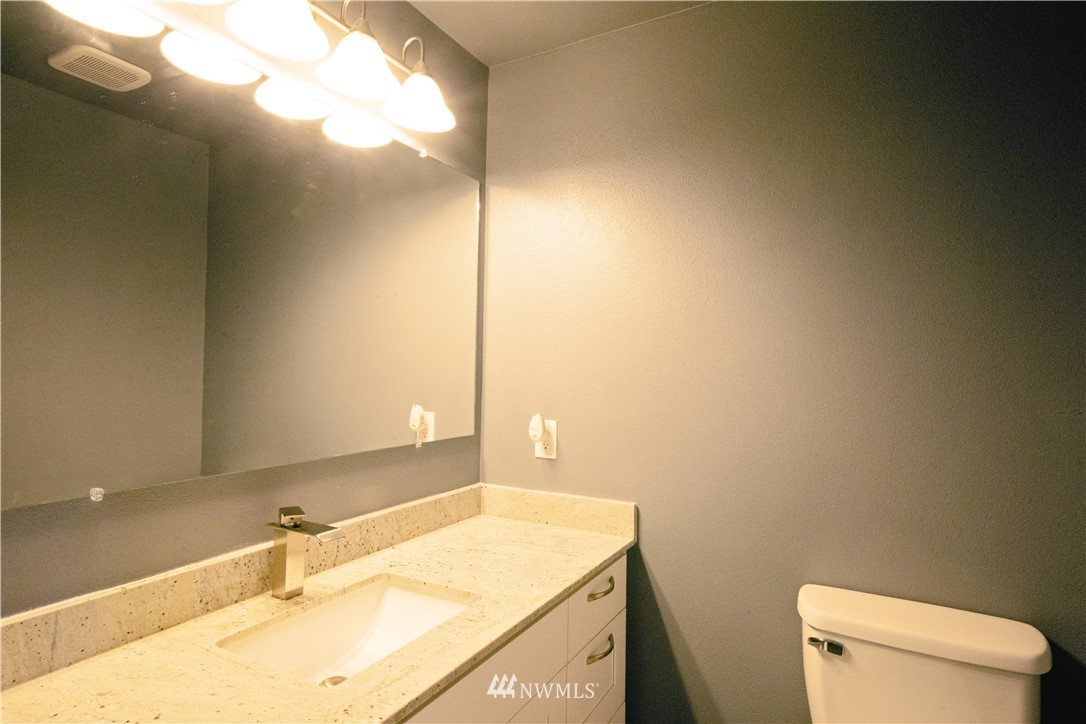 22316 6th Drive Southeast Bothell, WA 98021 - Photo 12 of 35 a bathroom with a sink vanity granite and toilet