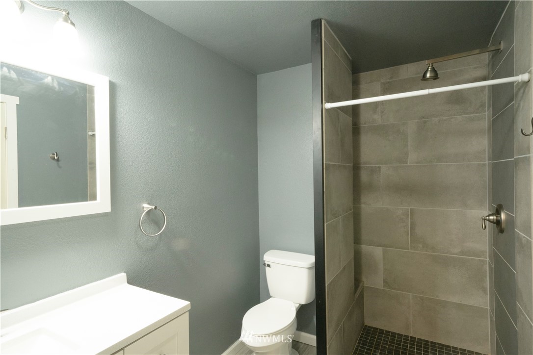 22316 6th Drive Southeast Bothell, WA 98021 - Photo 16 of 35 a bathroom with a toilet a sink and shower