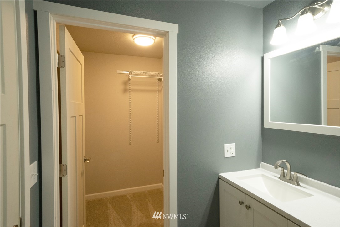 22316 6th Drive Southeast Bothell, WA 98021 - Photo 17 of 35 a bathroom with a sink and mirror