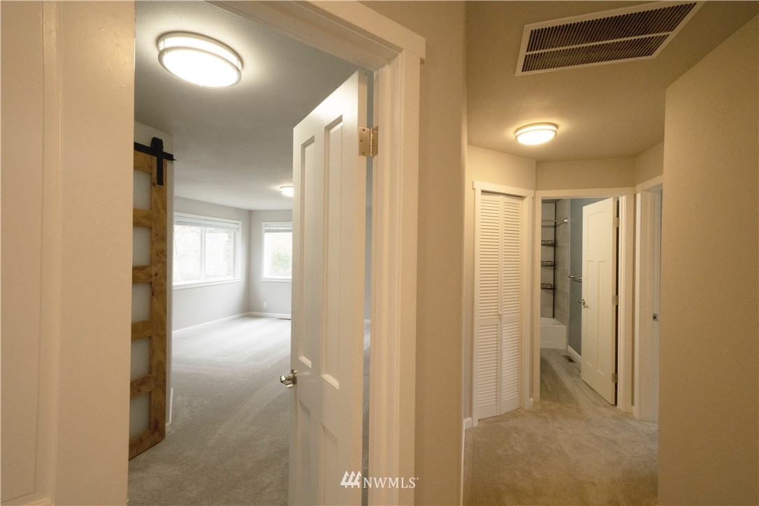 22316 6th Drive Southeast Bothell, WA 98021 - Photo 19 of 35 a view of a hallway with wooden floor