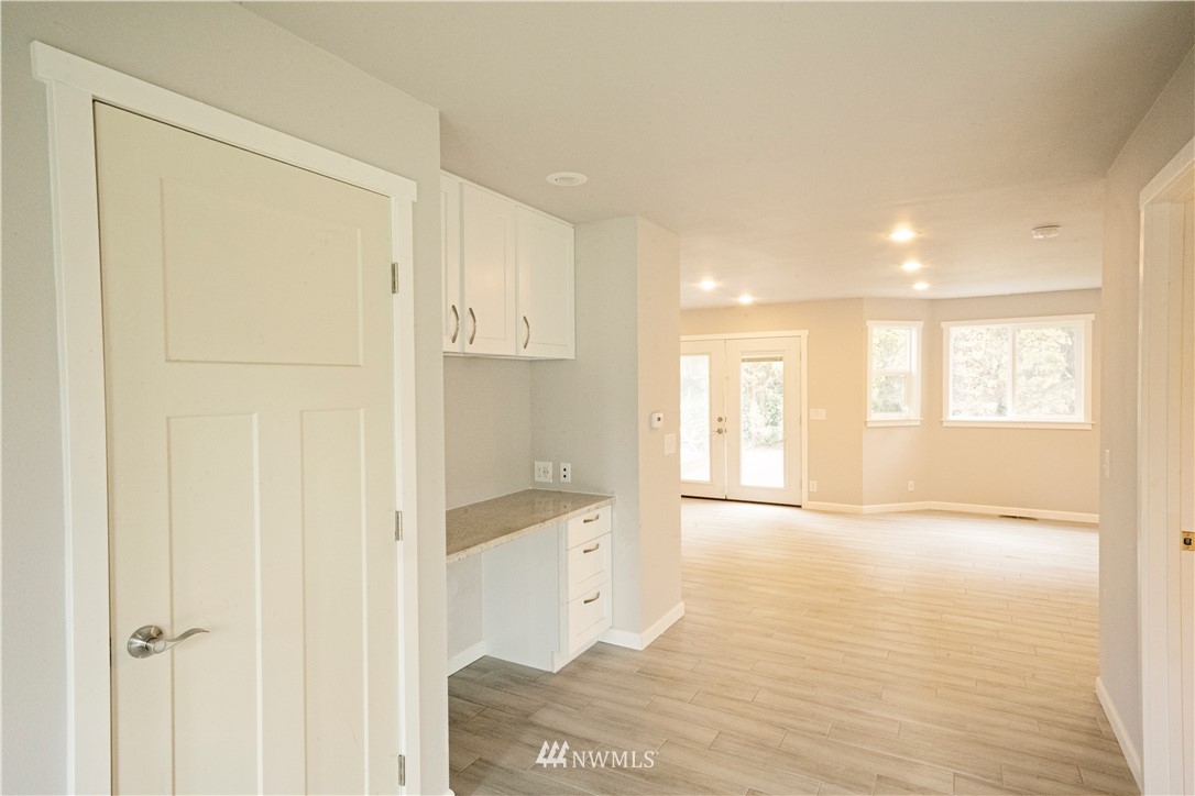 22316 6th Drive Southeast Bothell, WA 98021 - Photo 3 of 35 a view of an empty room with window and wooden floor