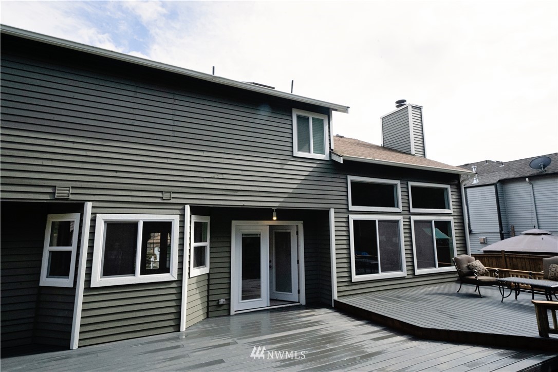 22316 6th Drive Southeast Bothell, WA 98021 - Photo 32 of 35 a view of a house with a barbeque and wooden stairs