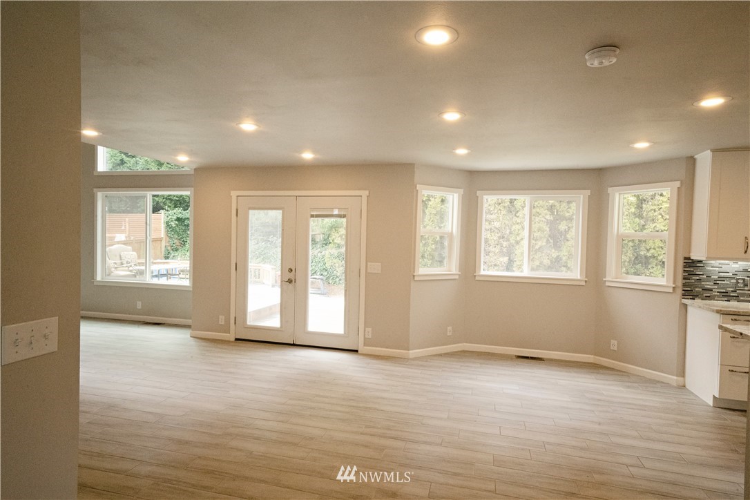 22316 6th Drive Southeast Bothell, WA 98021 - Photo 9 of 35 a view of an empty room with a window and wooden floor