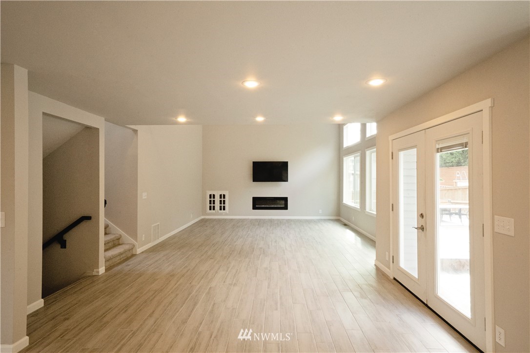 22316 6th Drive Southeast Bothell, WA 98021 - Photo 10 of 35 a view of a big room with wooden floor and windows