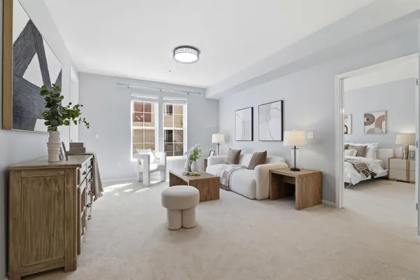 a living room with furniture and a large window