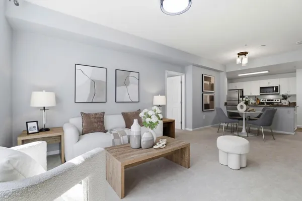 a living room with furniture and a table