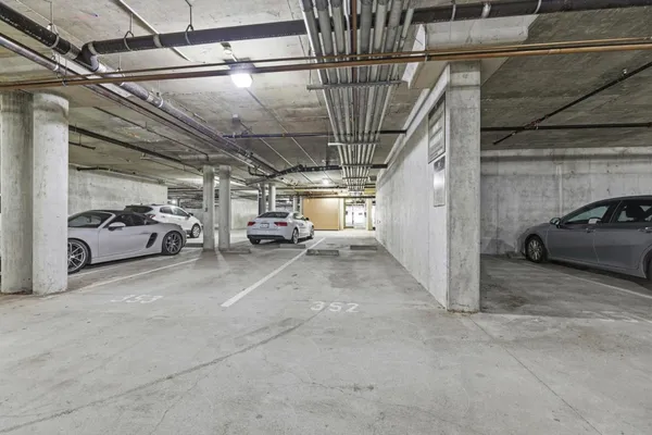 a view of parking garage with cars