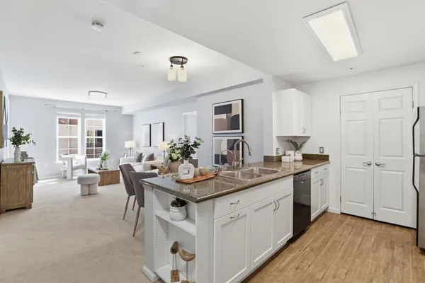 a view of a kitchen counter space and sink