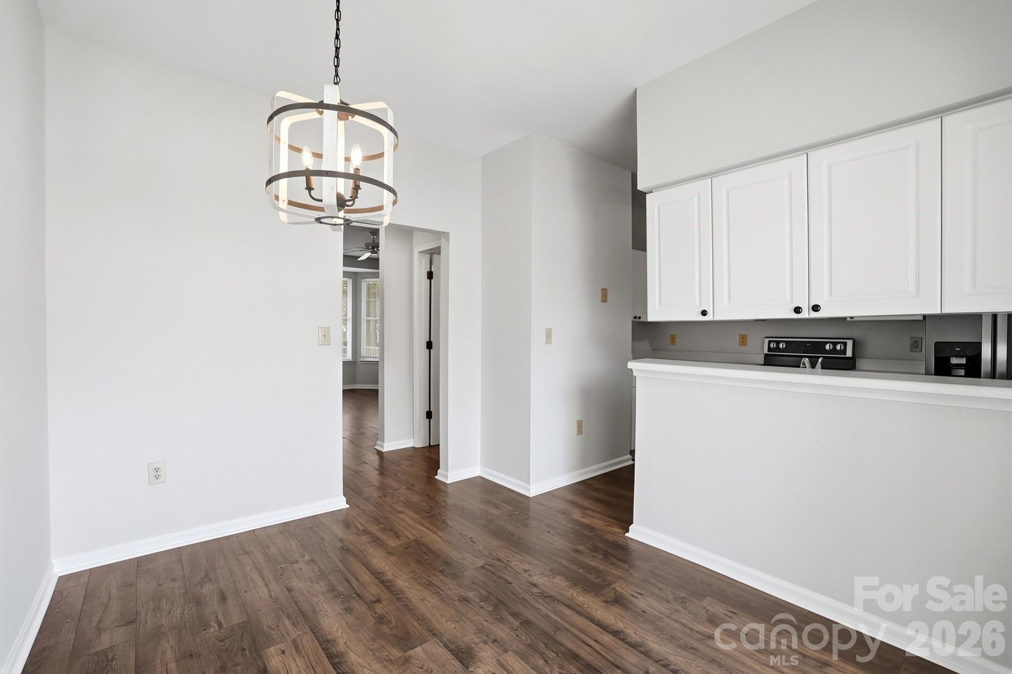 711 Stone Village Drive Fort Mill, SC 29708 - Photo 14 of 46 a view of a kitchen with wooden floor and cabinets