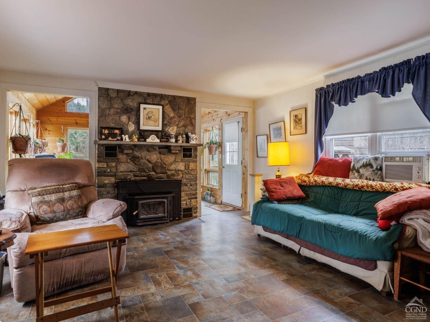25 Vets Road Windham, NY 12496 - Photo 16 of 74 a living room with furniture and a fireplace