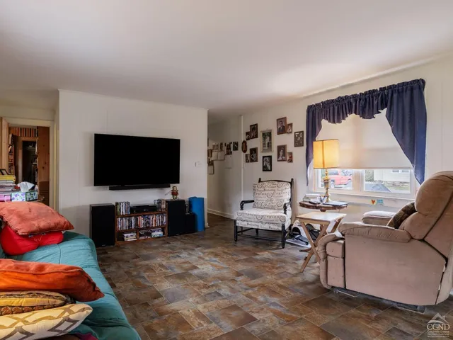 a view of a balcony with furniture and a rug
