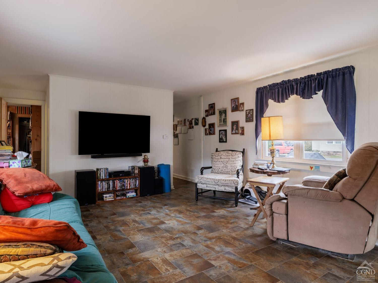 25 Vets Road Windham, NY 12496 - Photo 17 of 74 a living room with furniture and a flat screen tv