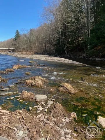 a kitchen with stainless steel appliances a sink and a refrigerator