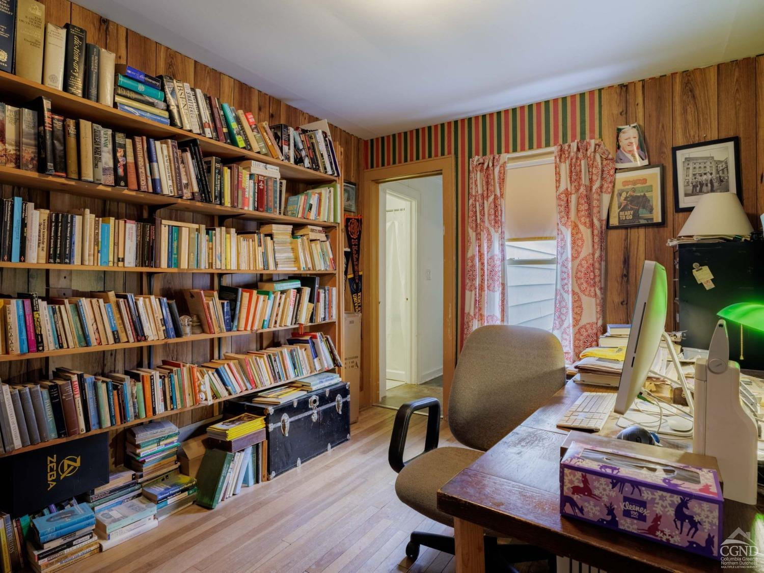 25 Vets Road Windham, NY 12496 - Photo 31 of 74 a view of a livingroom with furniture and a bookshelf