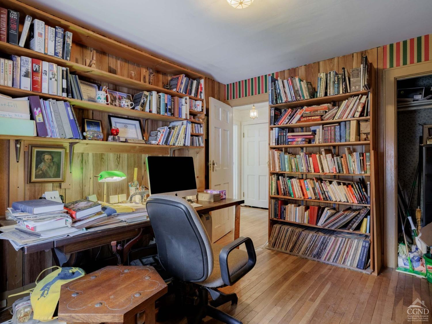 25 Vets Road Windham, NY 12496 - Photo 32 of 74 a view of a workspace with bookshelf and a window