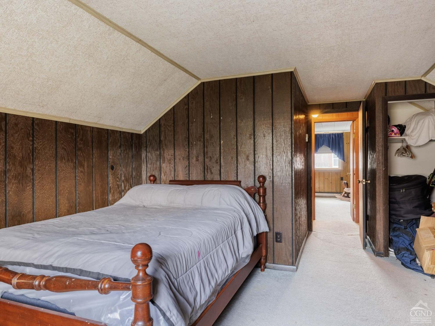 25 Vets Road Windham, NY 12496 - Photo 35 of 74 a bed sitting in a spacious bedroom next to a bedroom