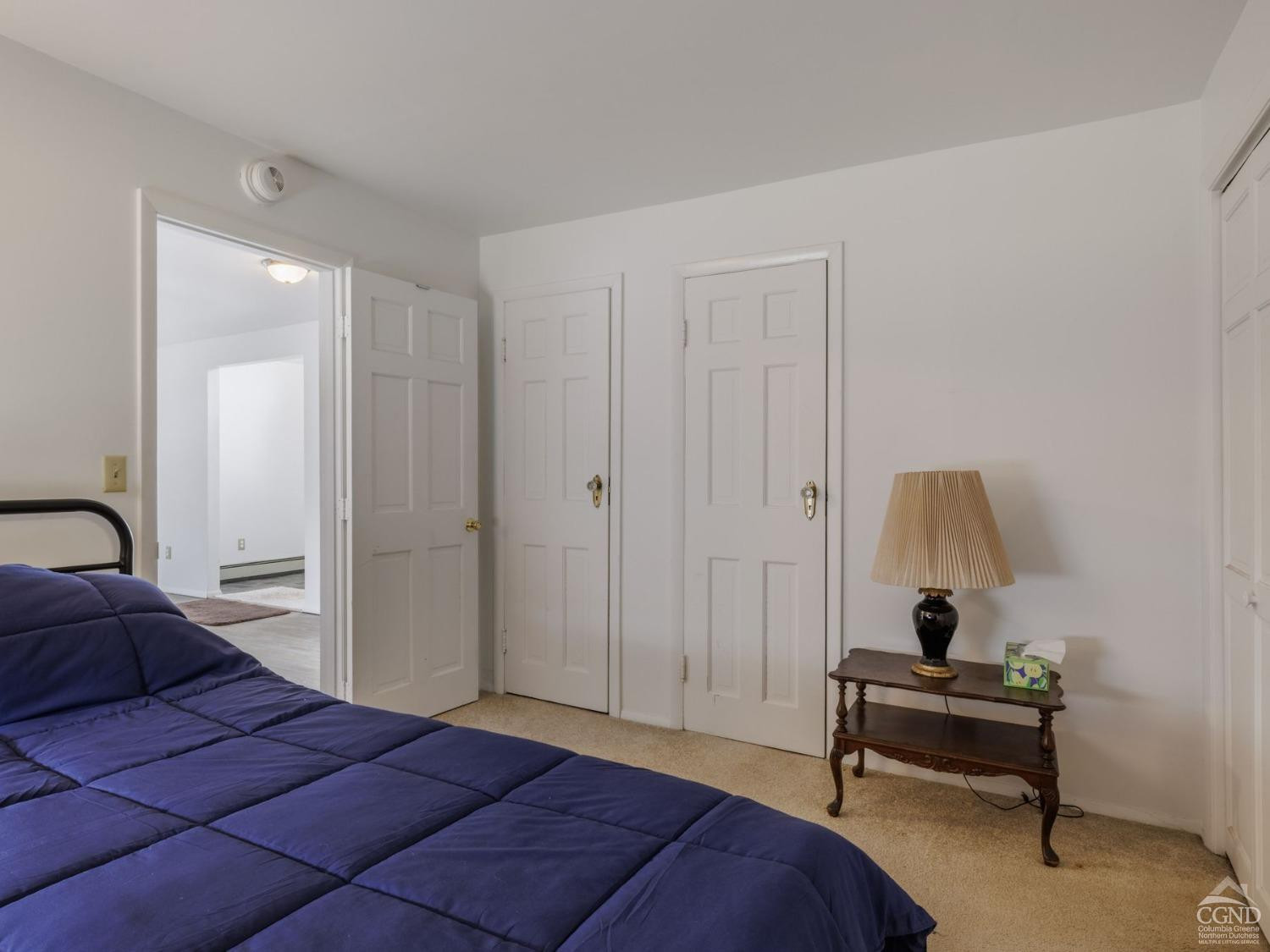 25 Vets Road Windham, NY 12496 - Photo 48 of 74 a bedroom with a bed and a chandelier