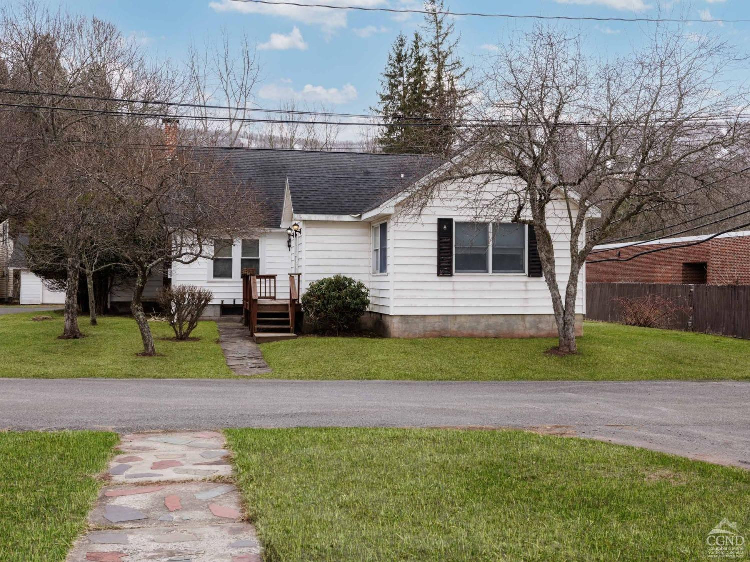 25 Vets Road Windham, NY 12496 - Photo 57 of 74 a front view of a house with a garden and plants