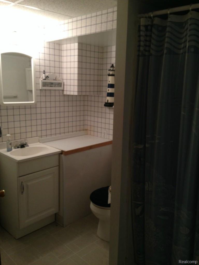 3990 Beattie Road Howell, MI 48843 - Photo 23 of 34 Lower Level Original Half Bathroom.jpg