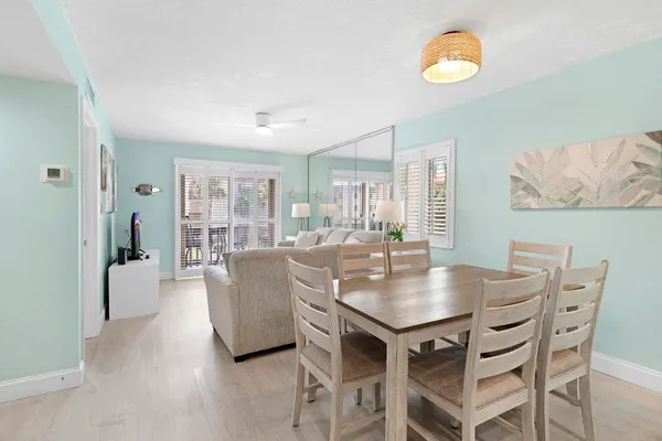 a view of a dining room and livingroom with furniture