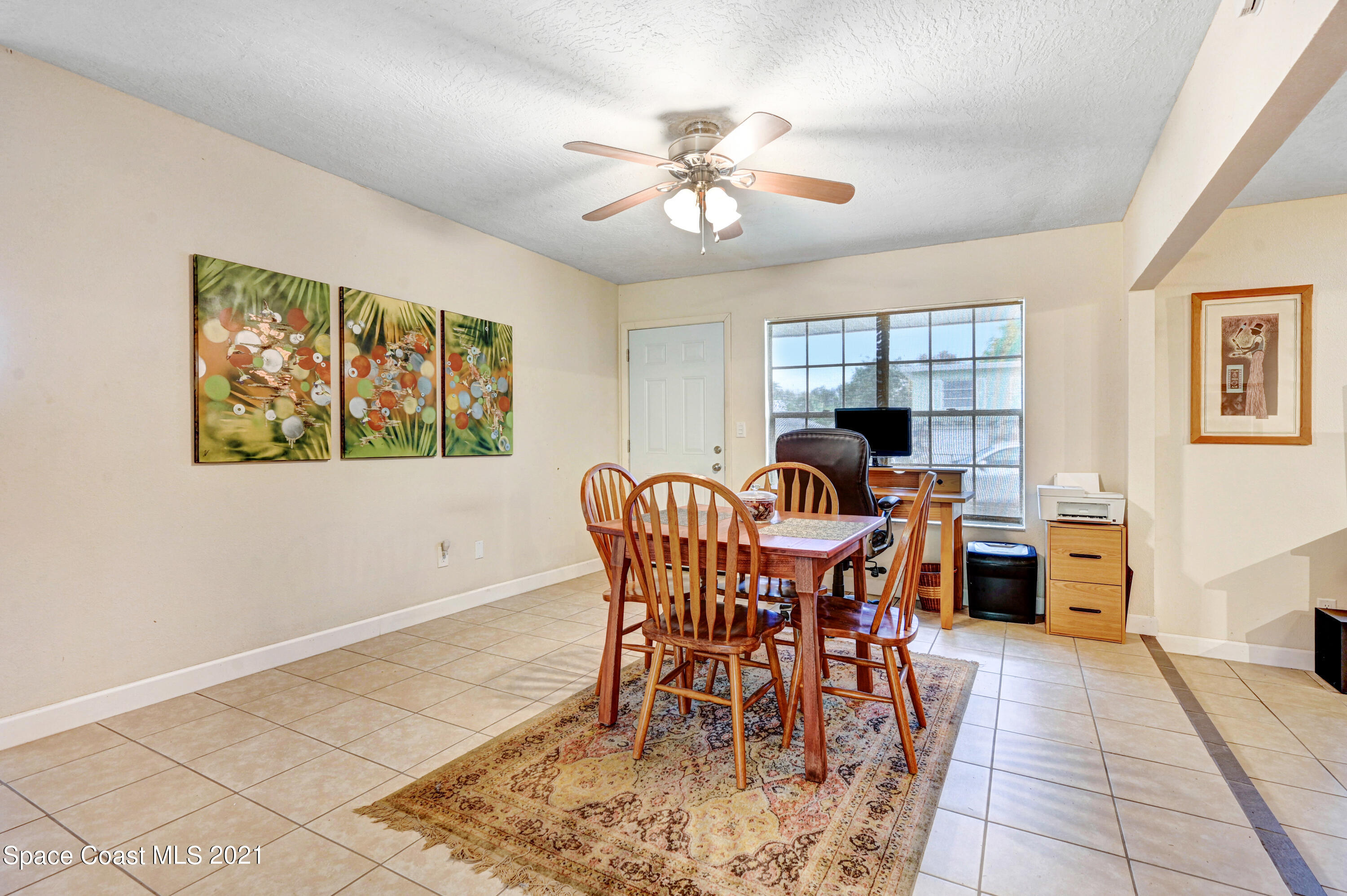 1537 Magnolia Street Northeast Palm Bay, FL 32905 - Photo 19 of 29 a view of a dining room with furniture