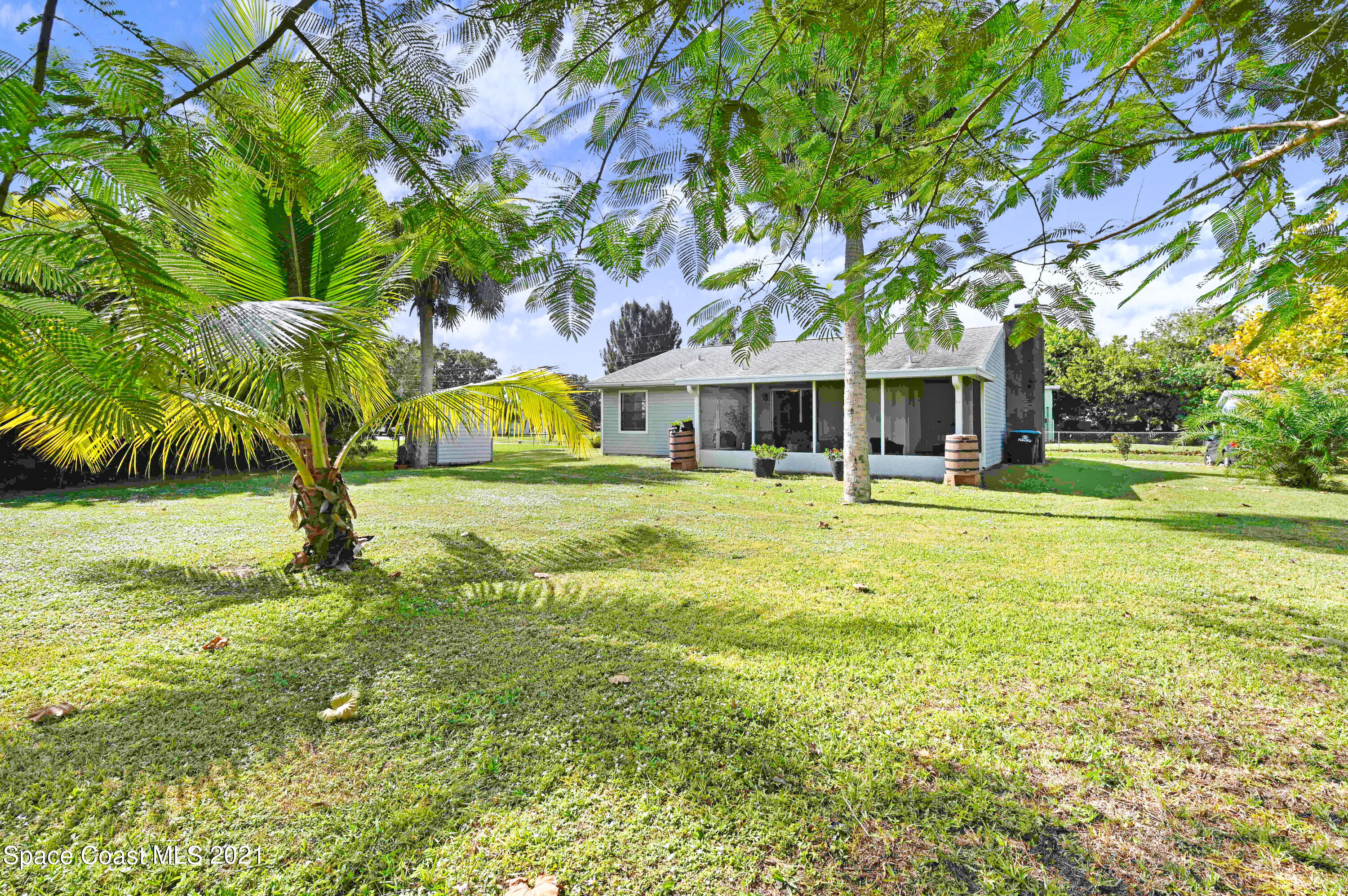 1537 Magnolia Street Northeast Palm Bay, FL 32905 - Photo 5 of 29 a view of swimming pool with outdoor seating and yard