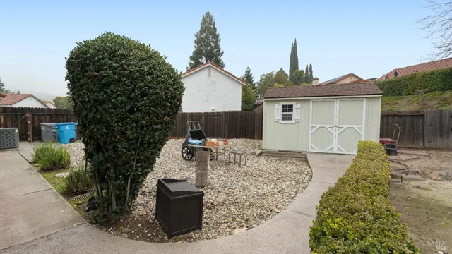 a view of a house with a yard and a garden