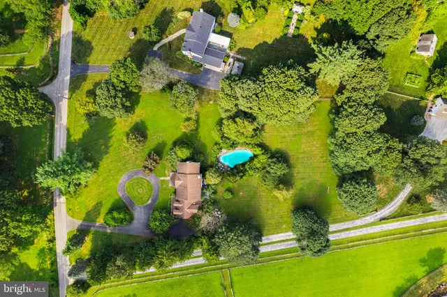 an aerial view of a house with a garden