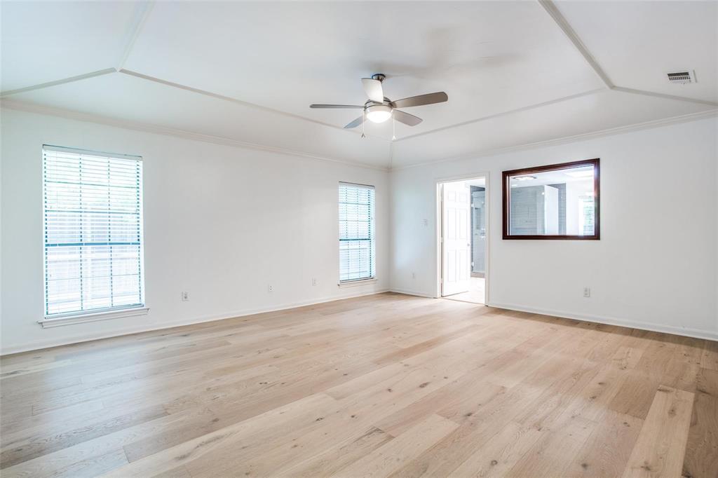 6926 Northwood Road Dallas, TX 75225 - Photo 22 of 29 wooden floor in an empty room with a window