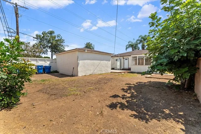 a bathroom with a granite countertop toilet sink and mirror