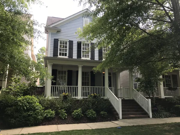 front view of a house with a small yard