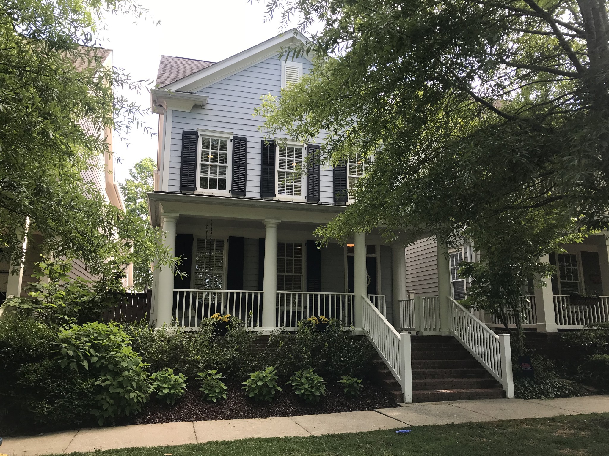 front view of a house with a small yard