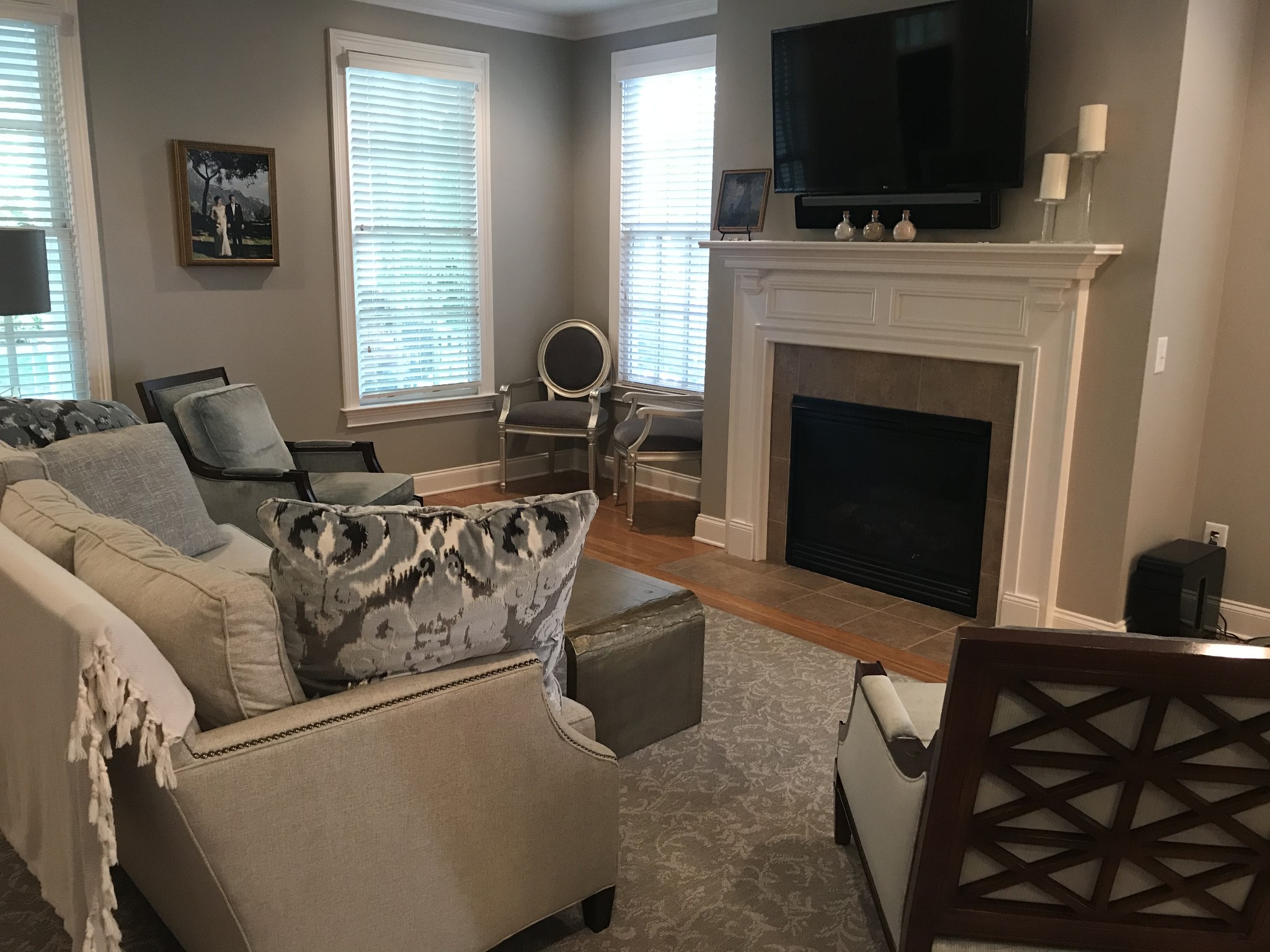 211 Acadia Avenue Franklin, TN 37064 - Photo 5 of 21 a living room with furniture a flat screen tv and a fireplace